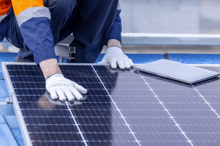 person working on solar panels
